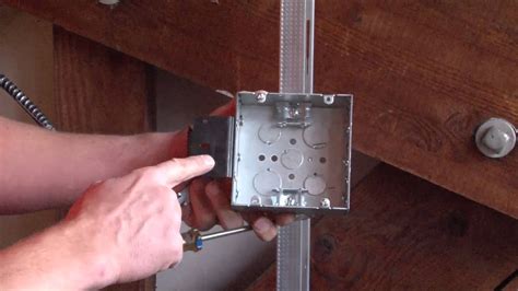 junction box over stud|screwed into stud box.